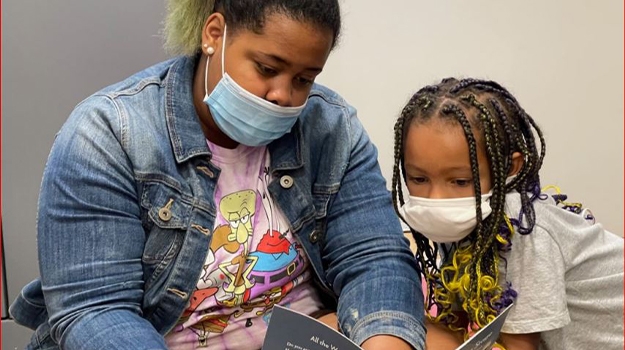 Two Girls Reading, photo credit Literacy Together