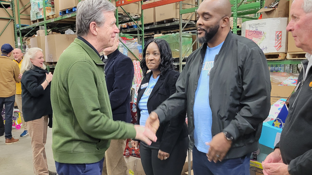 Kevin Montgomery Aisha Shepherd and Governor Roy Cooper